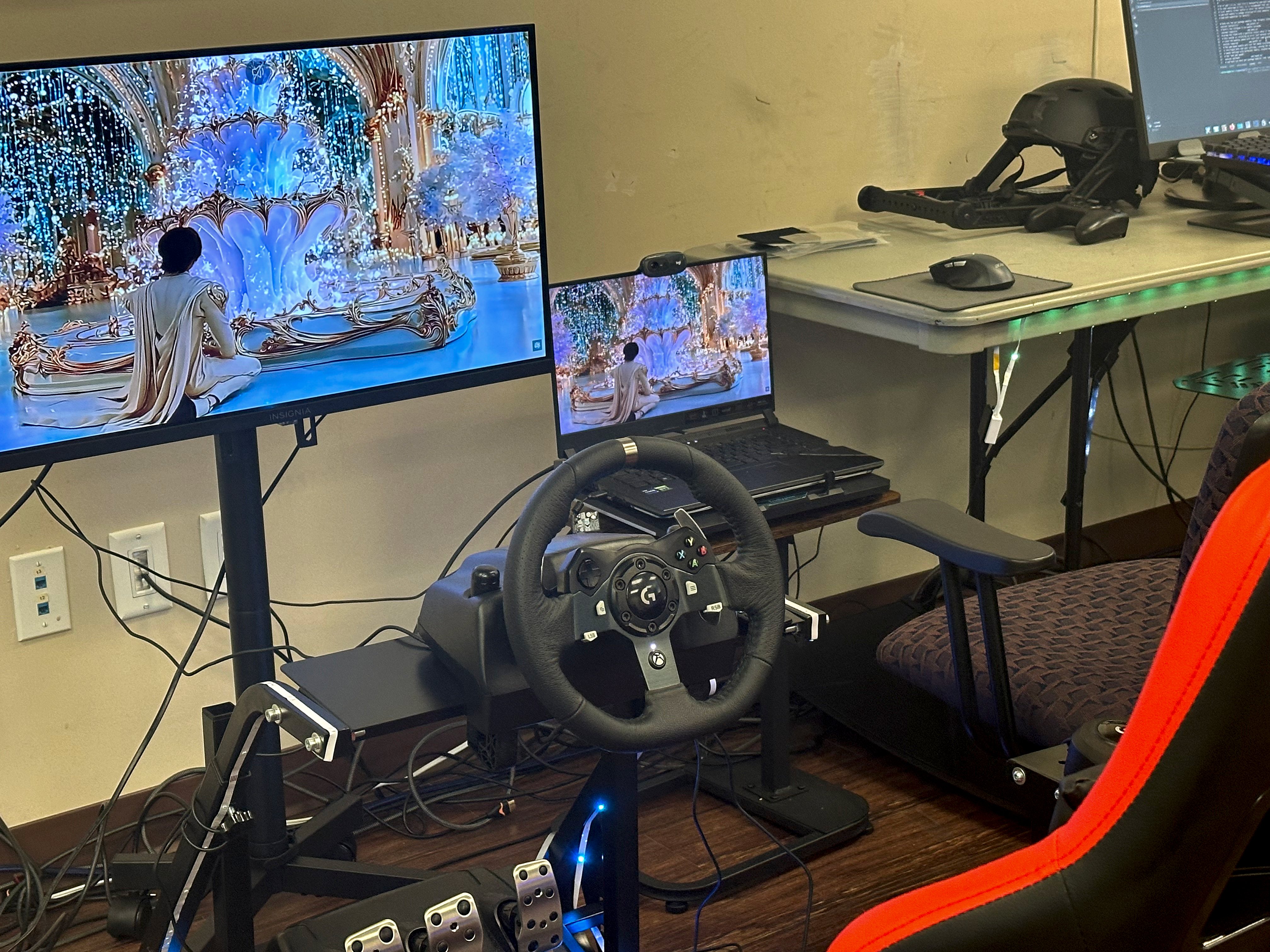 Racing simulator with multiple monitors and wheel setup