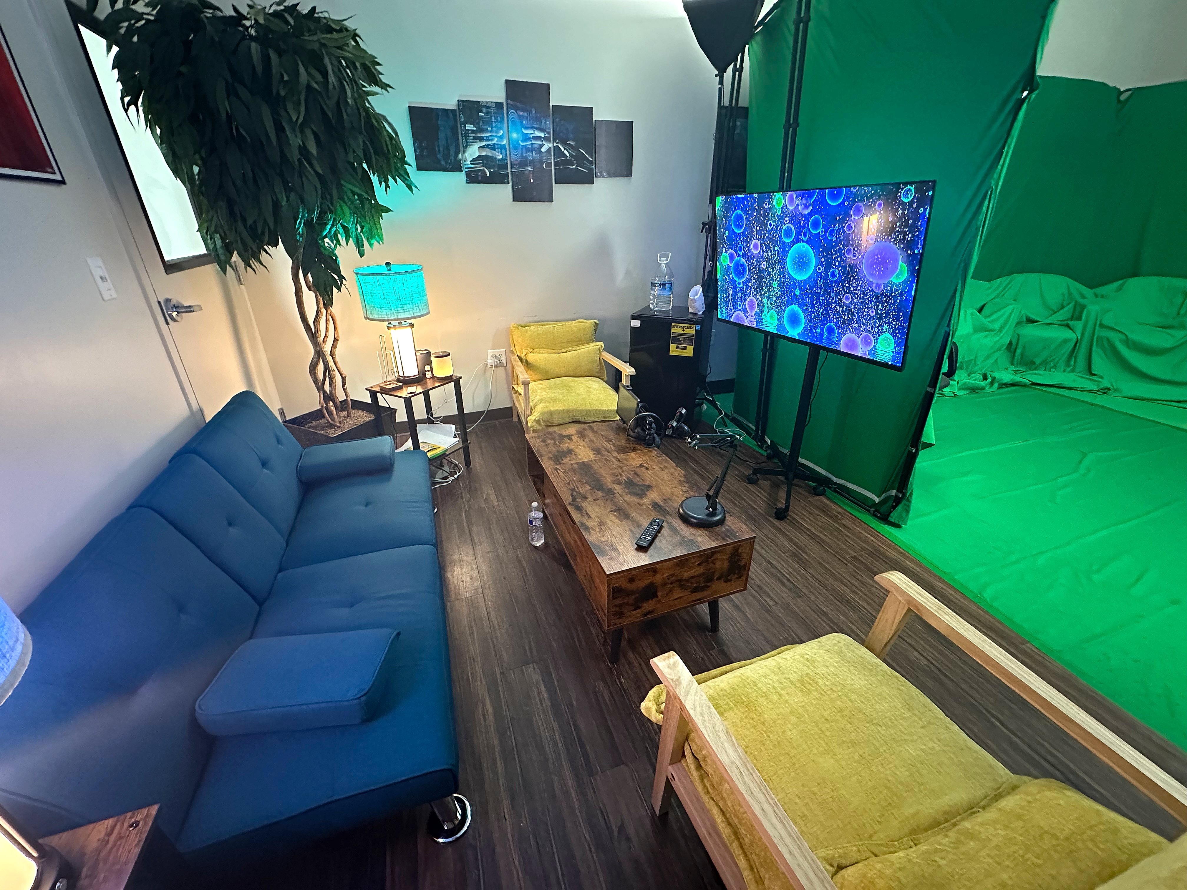 Modern streaming studio with green screen and professional displays