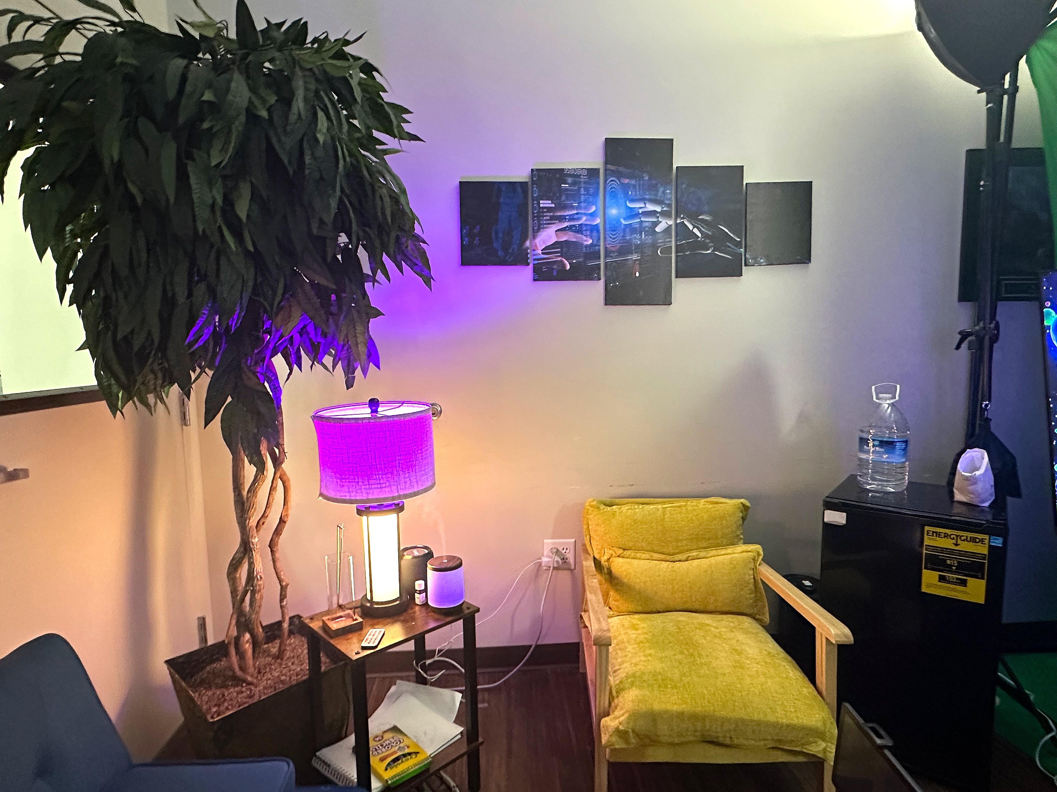 Creative studio with colorful lighting and multi-panel displays